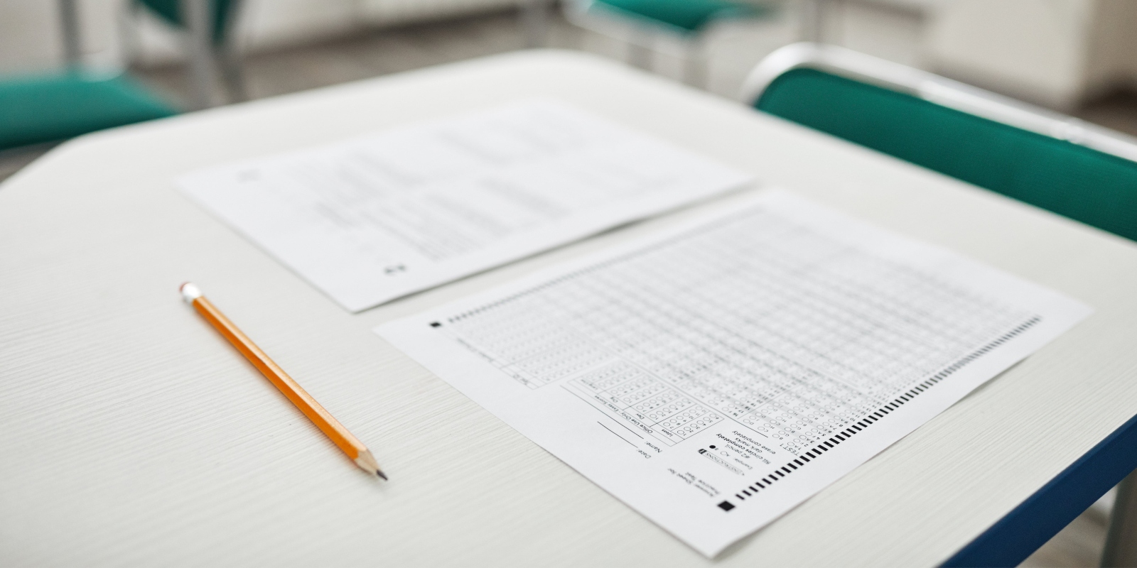 A pencil and a paper on a table.