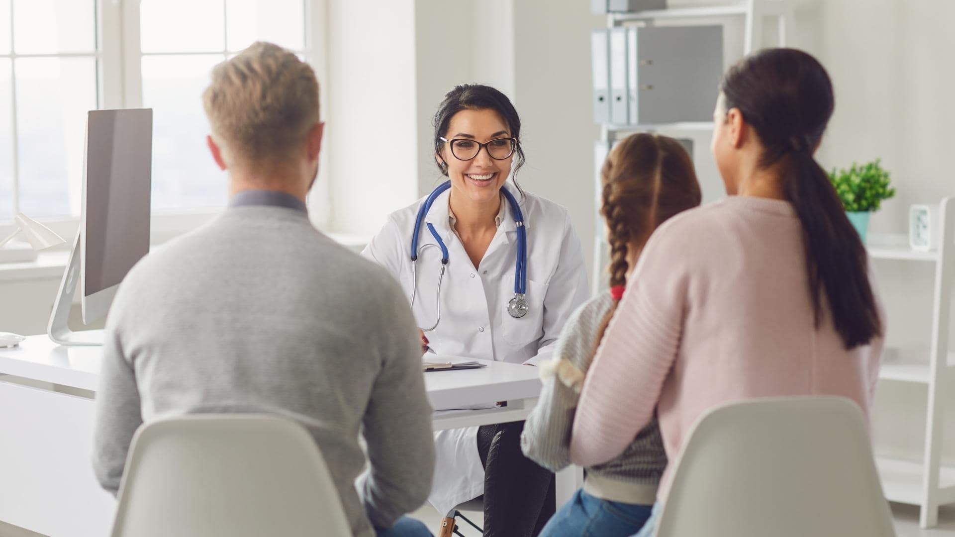 A doctor checking up a female child