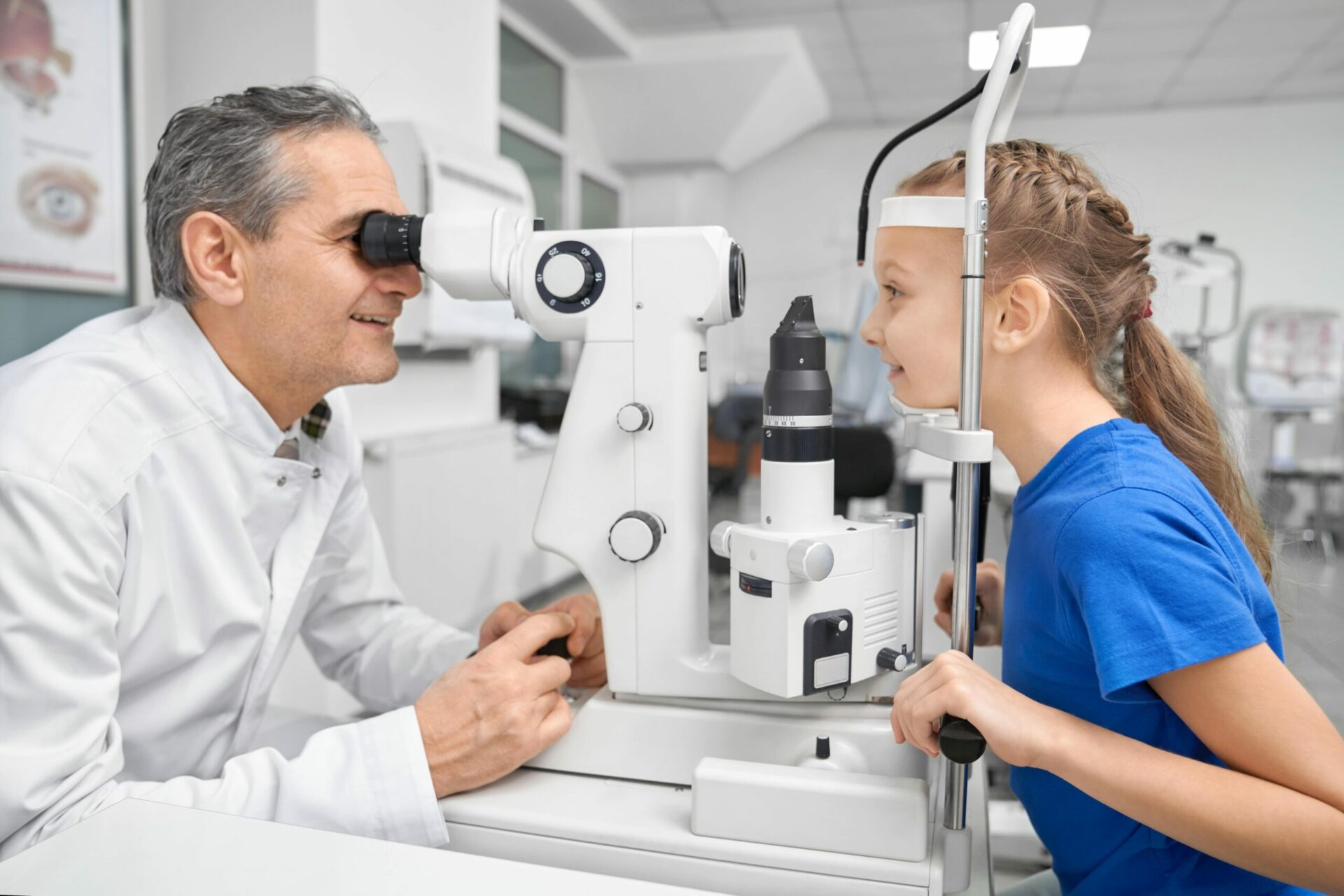 Eye doctor with child patient