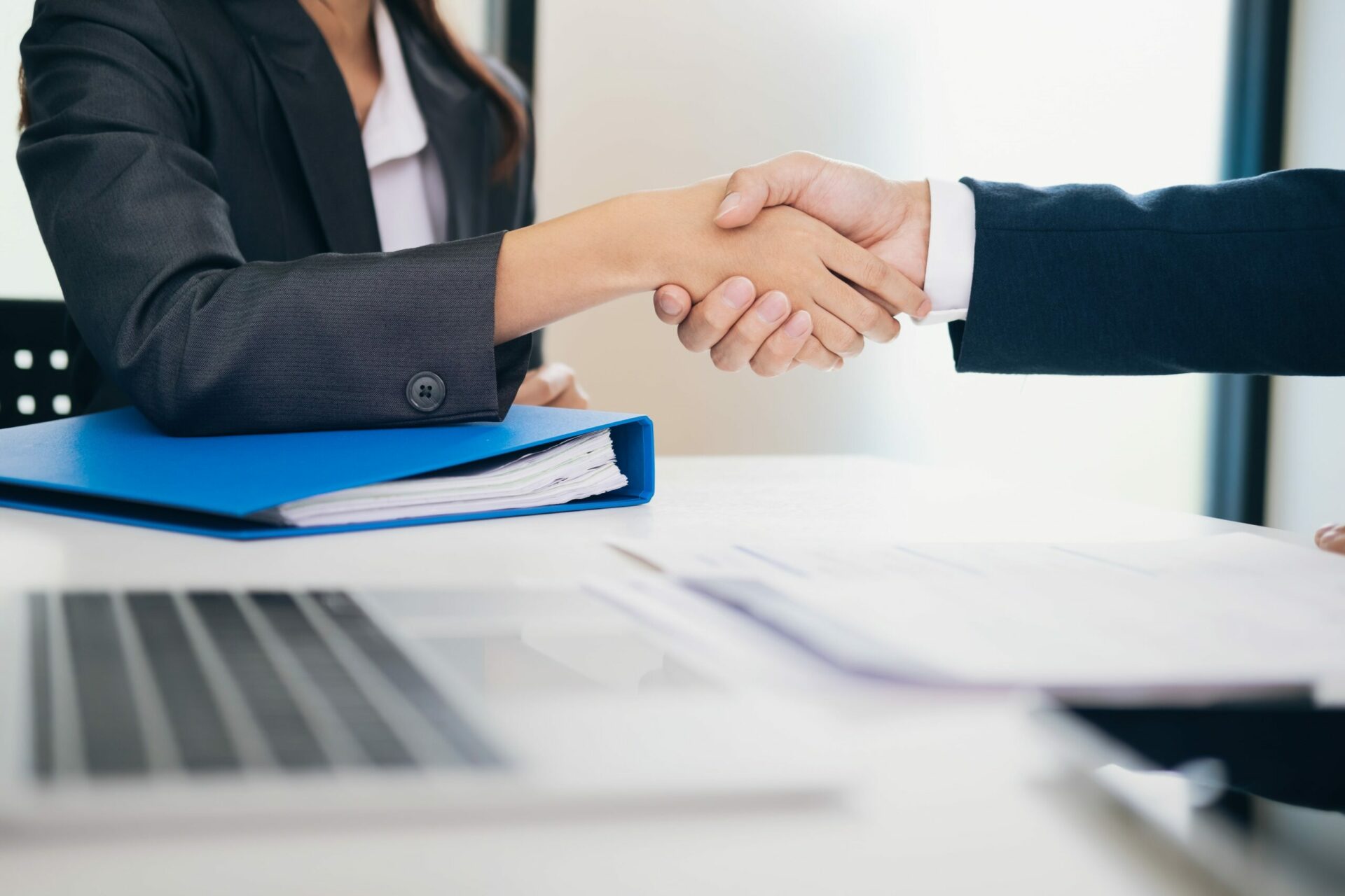 Handshake by man and woman