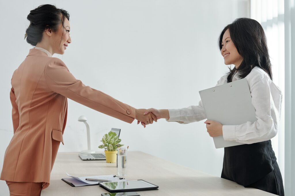 Human Resource manager handshake employee