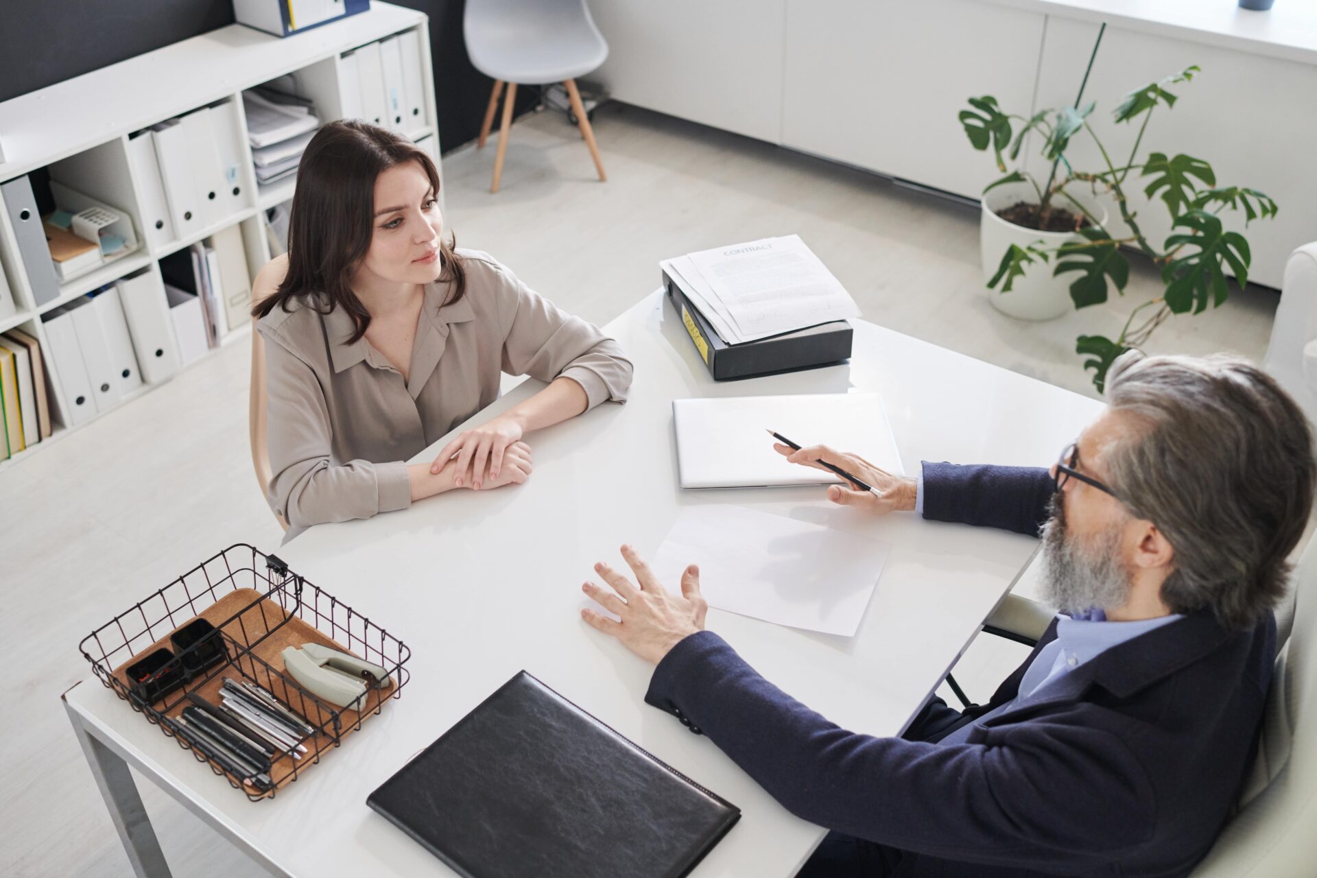 Woman being interviewed by man in office