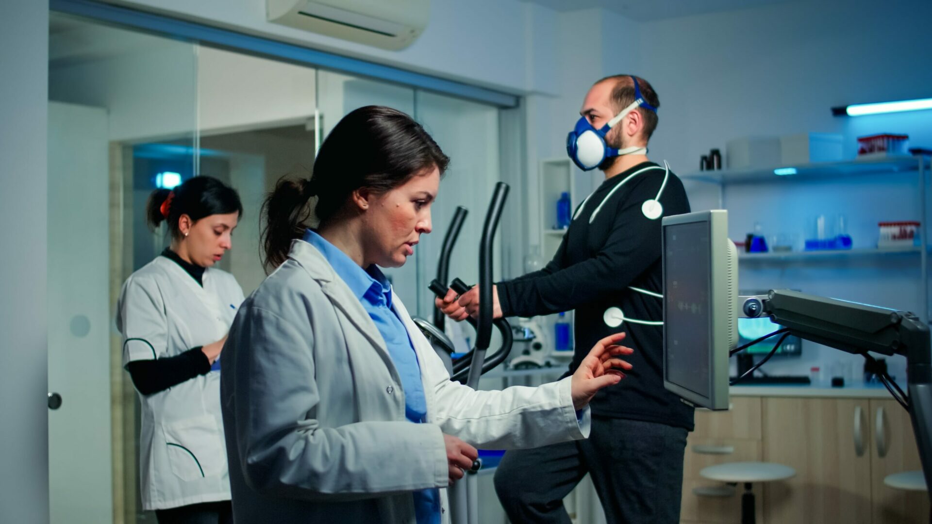 Sports doctor with patient examine strength