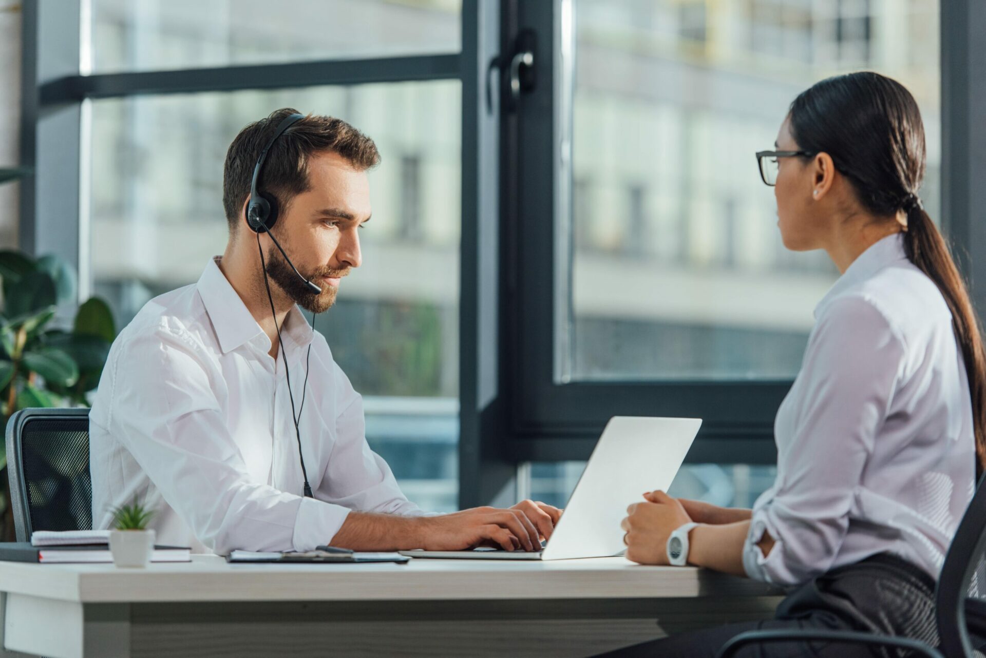 Transcriber with headphone and laptop