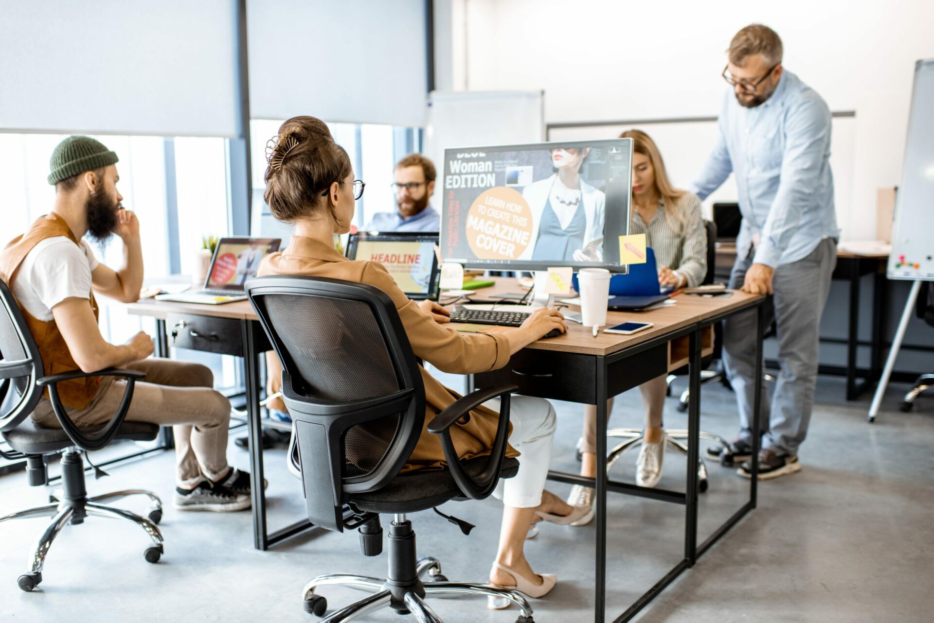 web designers in a table and working