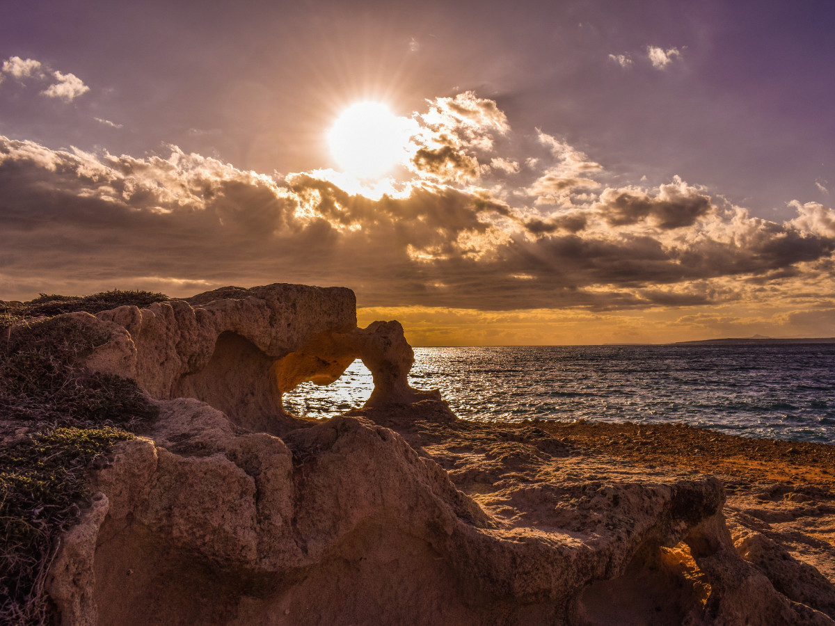 a rock formation on a beach