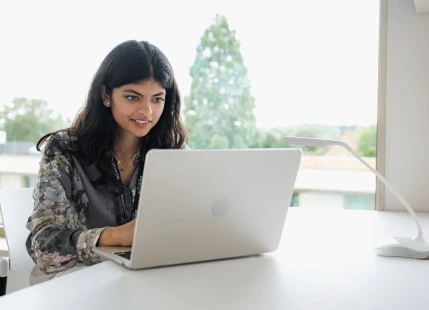 a woman using a laptop