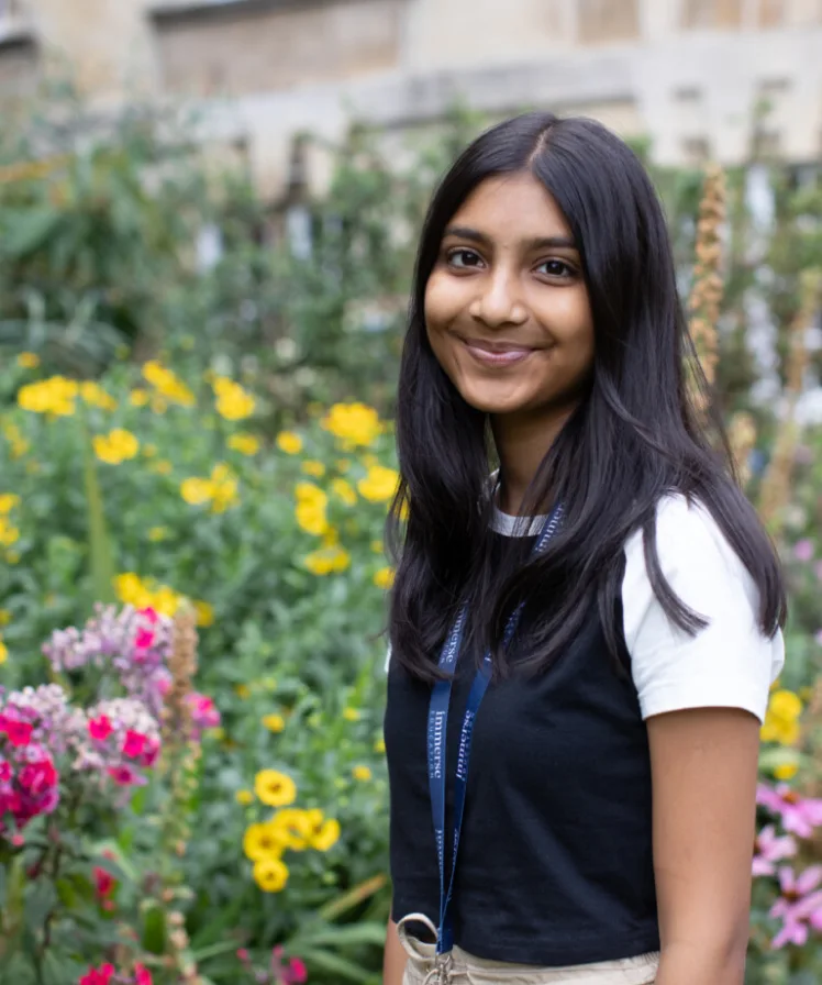 a girl student smiling at camera