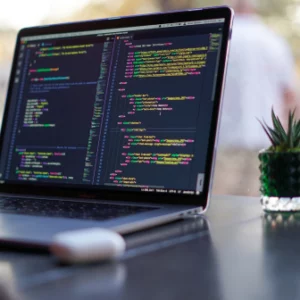 A laptop that shows programming codes.