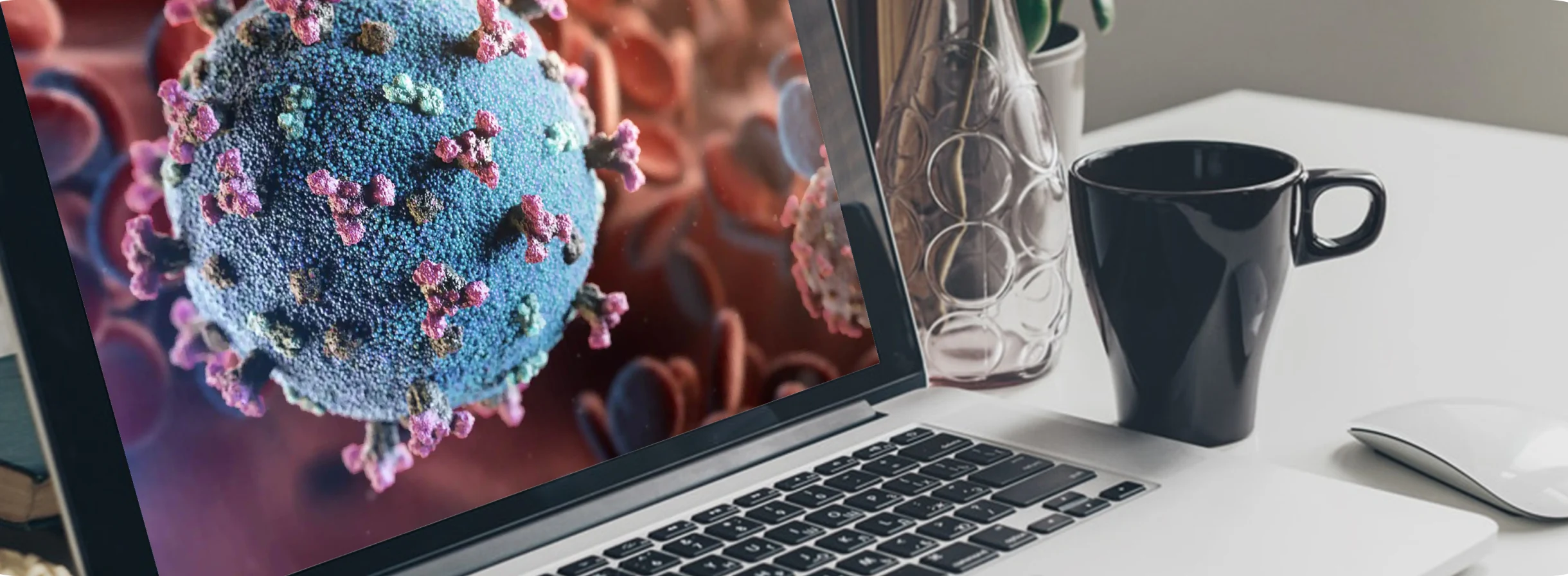 A close up photo of a virus shown in a laptop