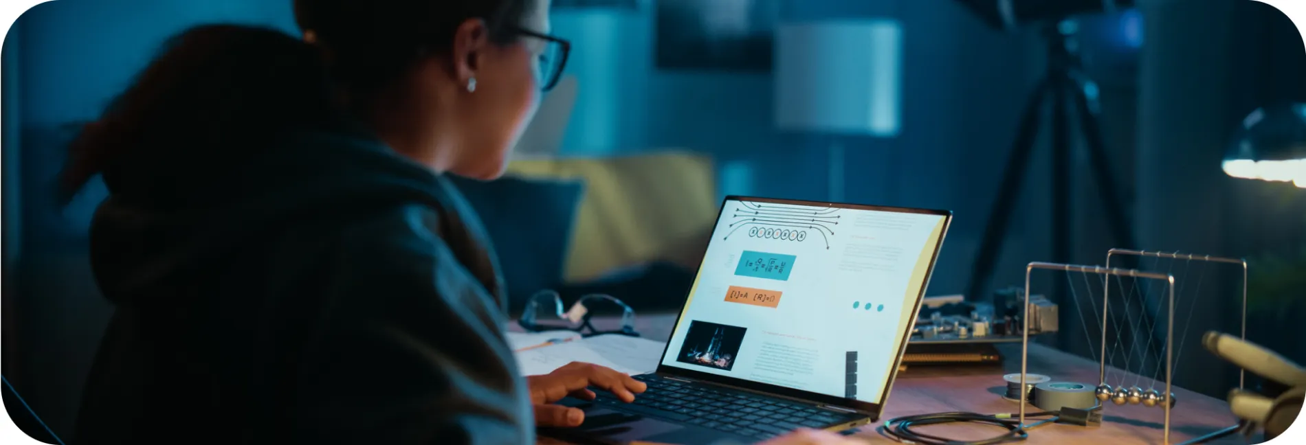 A woman studying a formula on her laptop