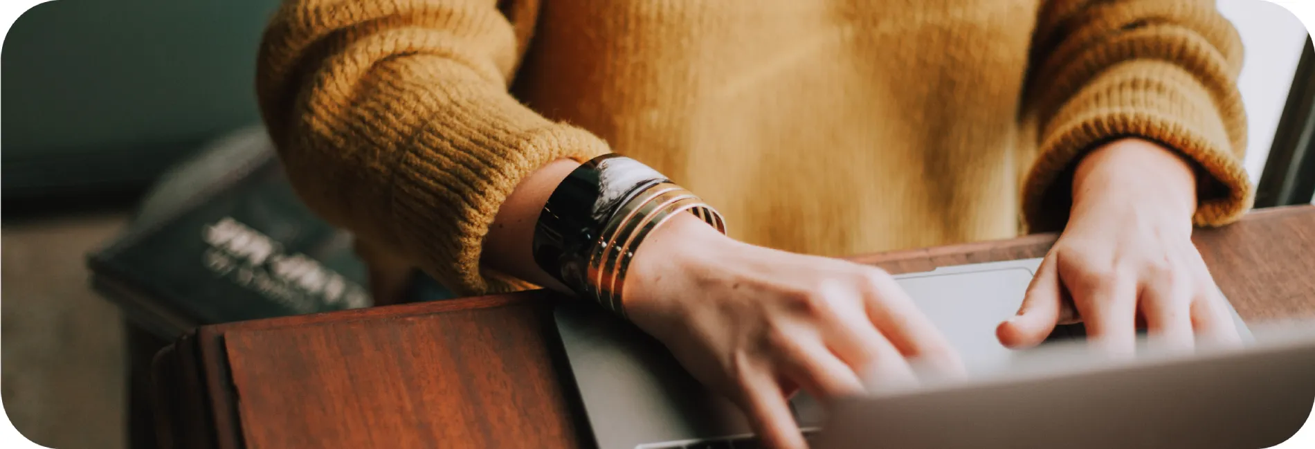 A person typing on her keyboard.