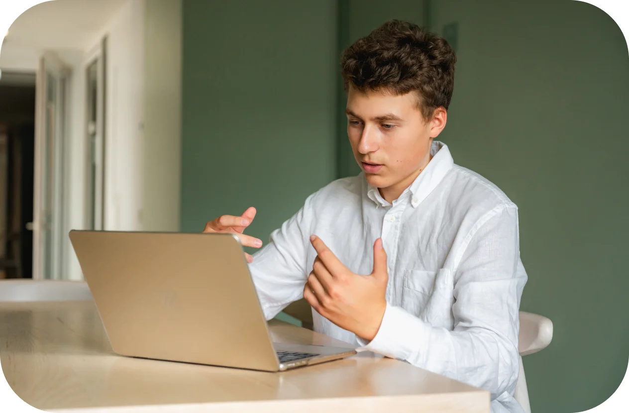 A man with a laptop in front of him