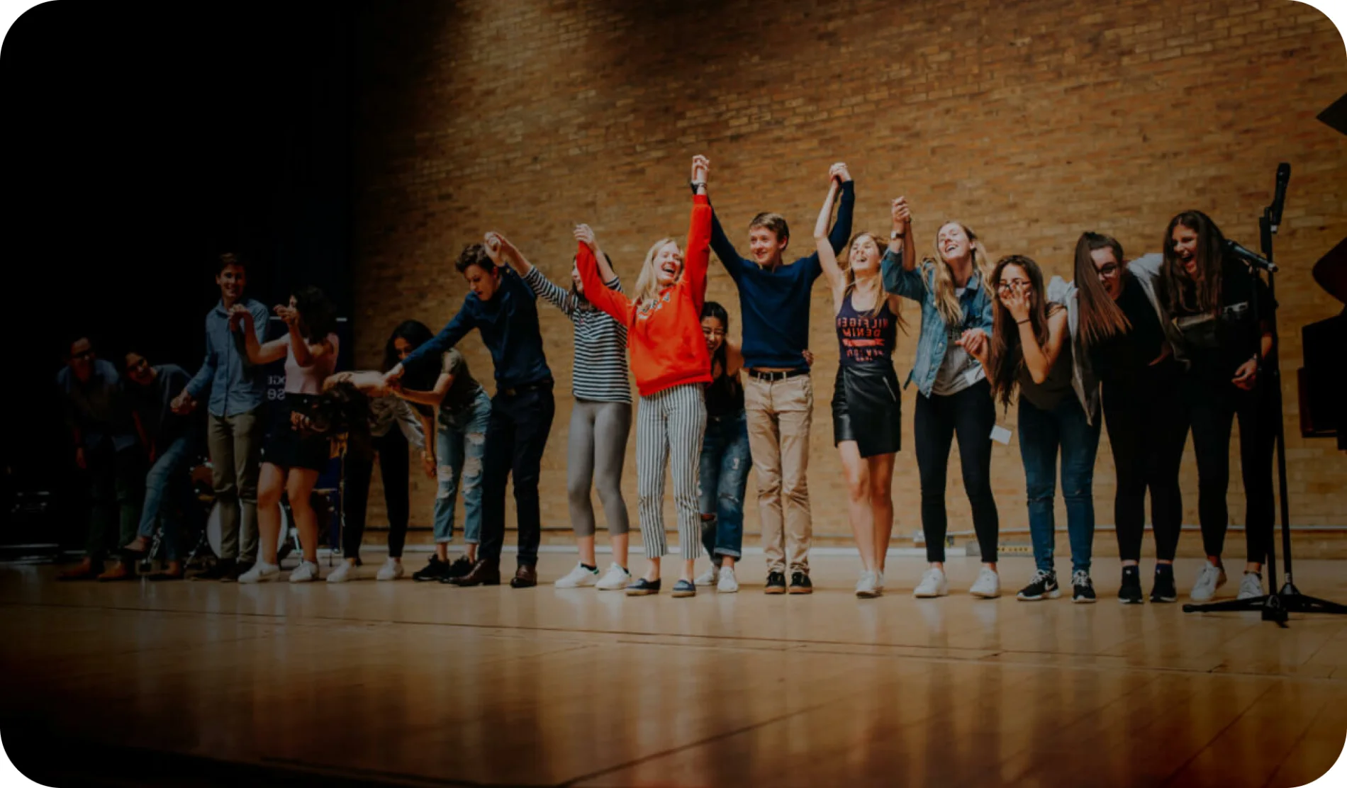 Students taking a bow on a stage