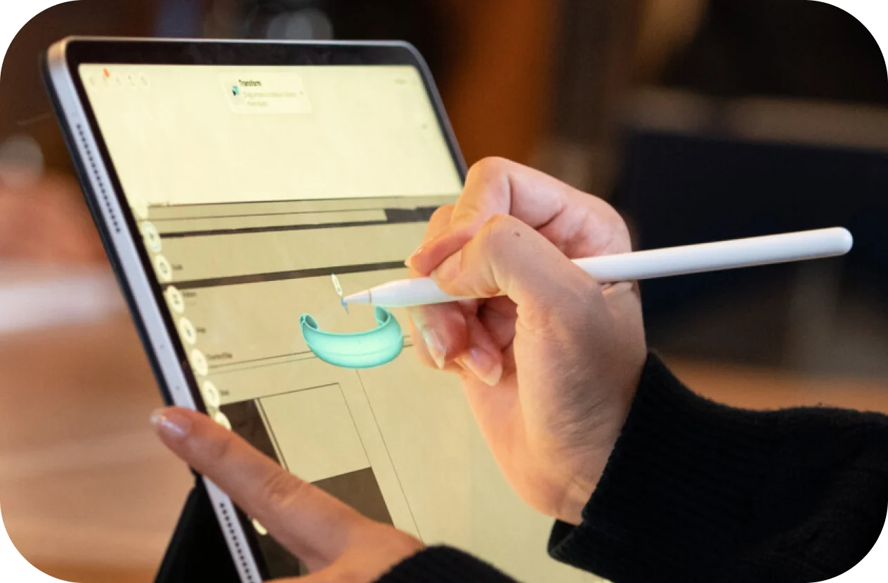 a person using a stylus on a tablet