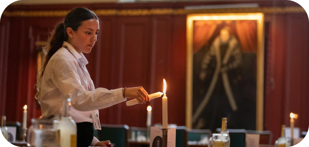 a woman lighting up a candle