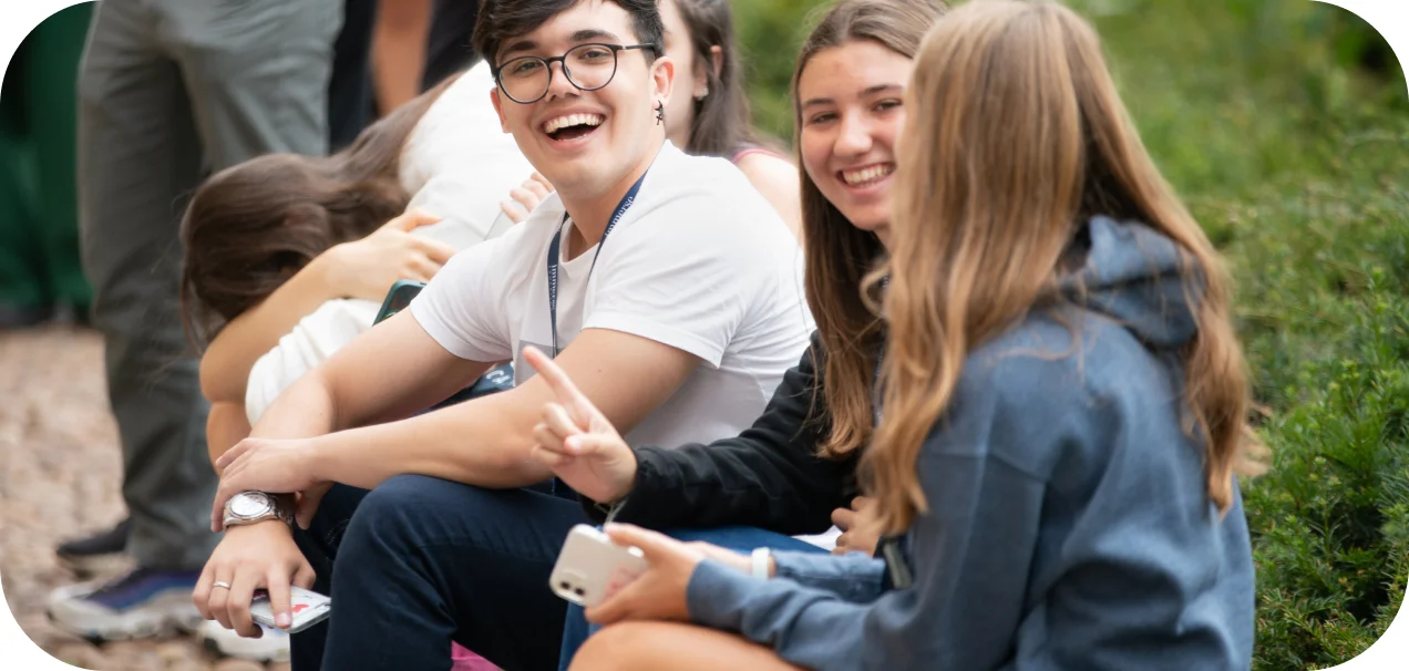 a group of students sitting together smiling