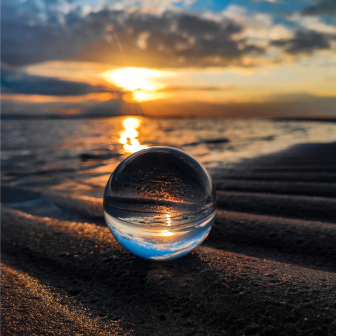 a glass ball on the beach