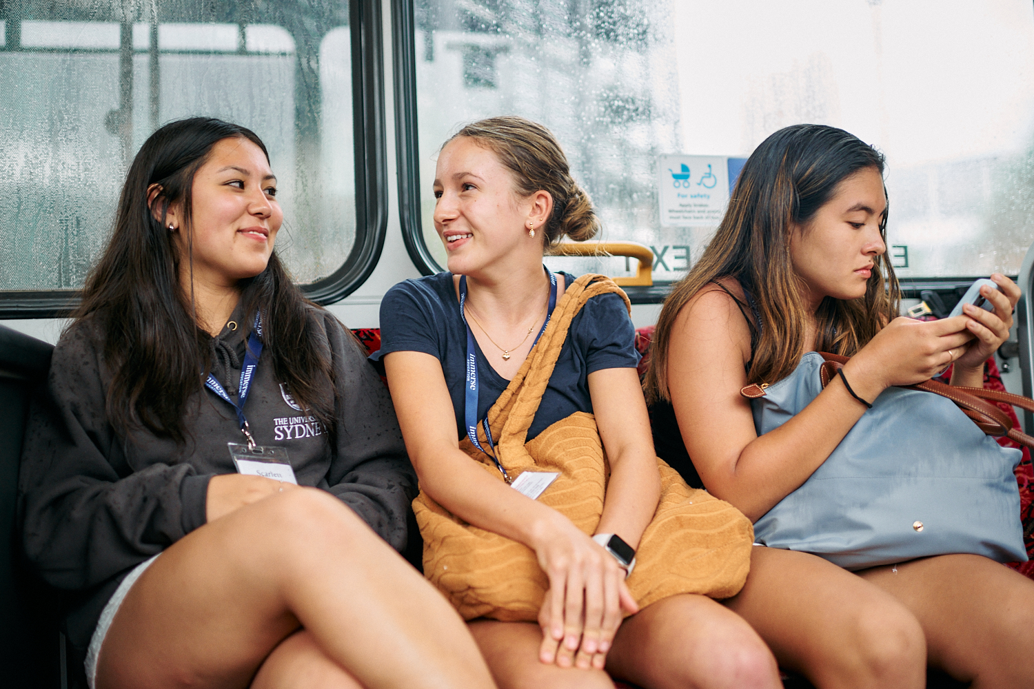 a group of women sitting on a bus