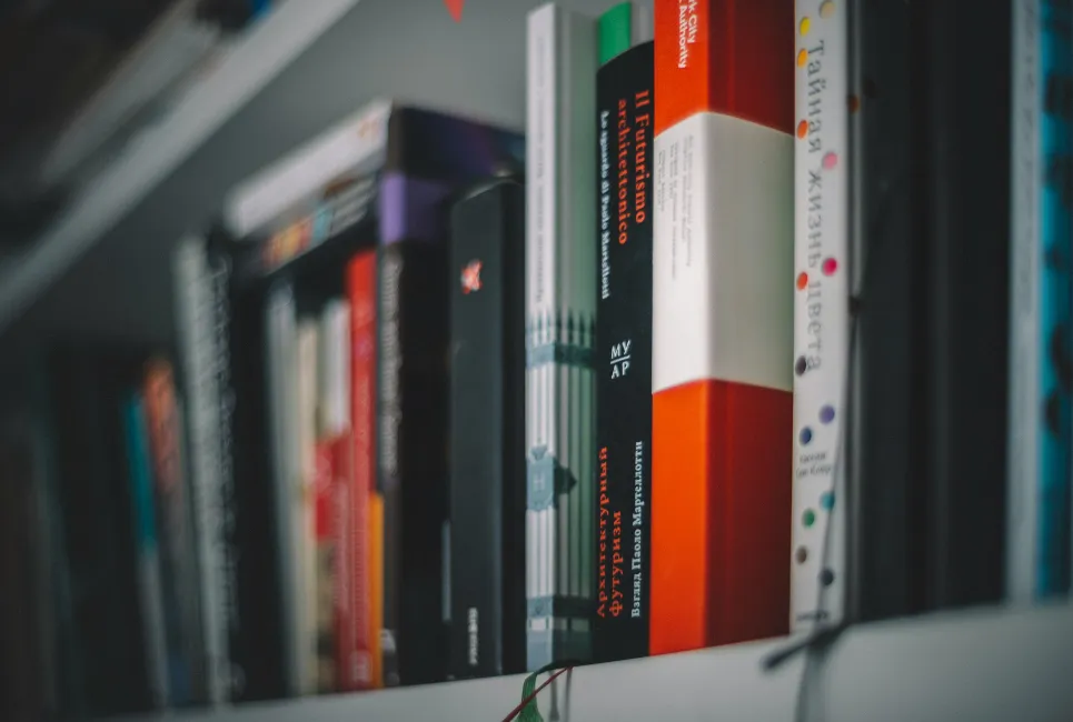 Academic study books on a shelf