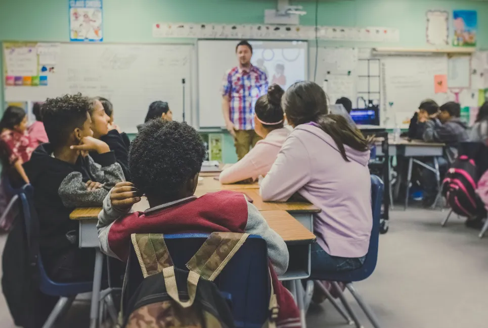 Classroom of kids with teacher in a lesson