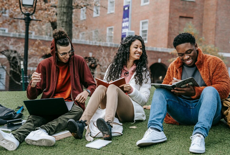 Three students studying outside 