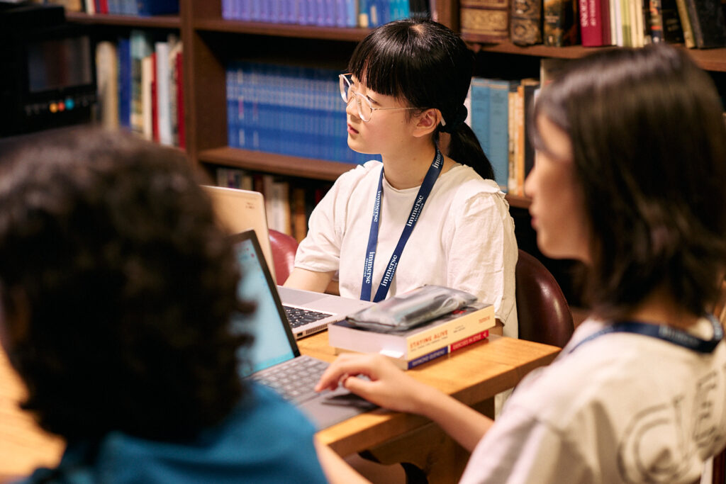 This image shows an Immerse student actively participating in a seminar, reflecting the philosophical inquiry and critical engagement typical of the Ayn Rand Essay Contest.