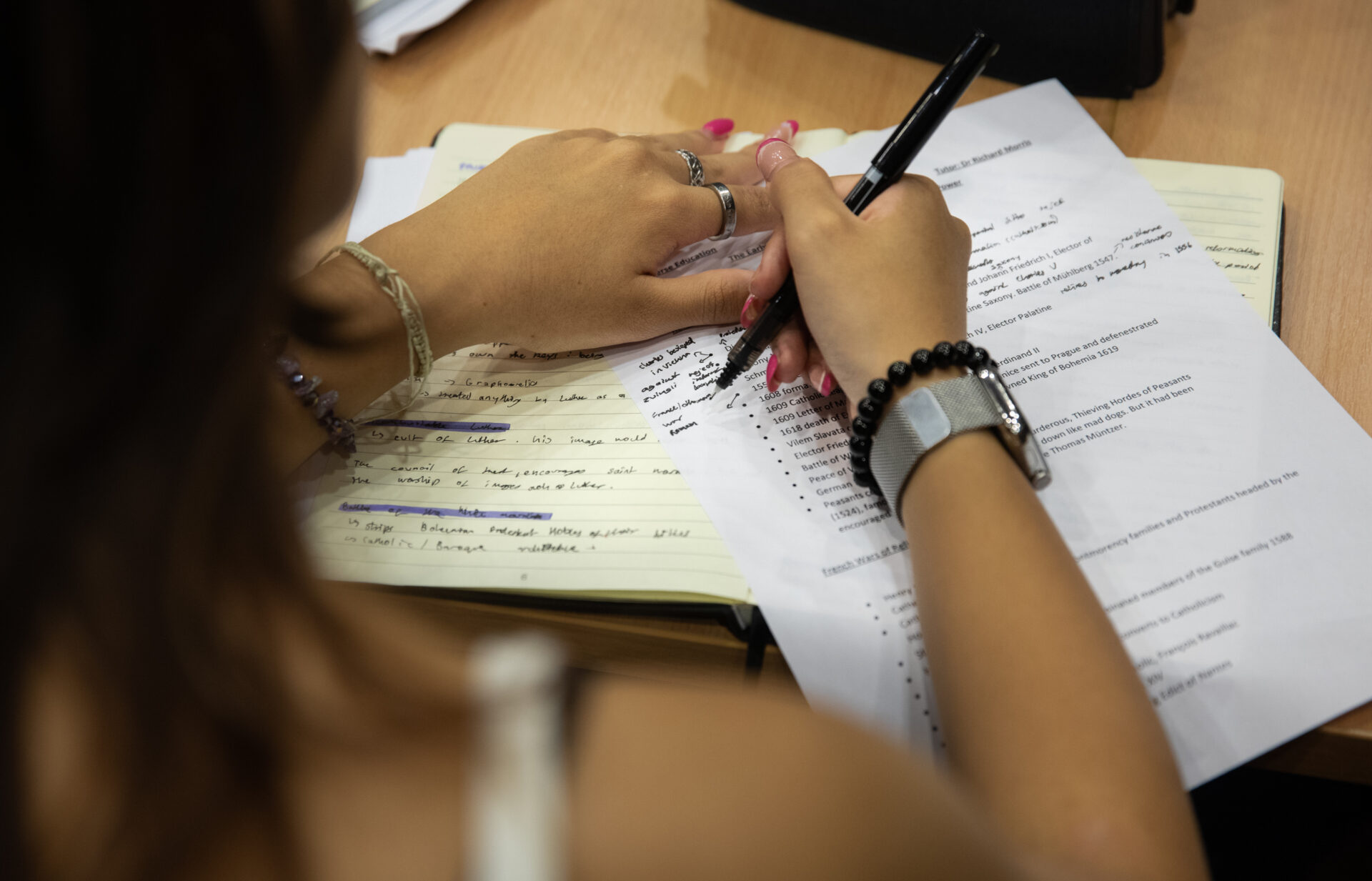 student on our Oxford summer program writing essay with Oxford referencing system