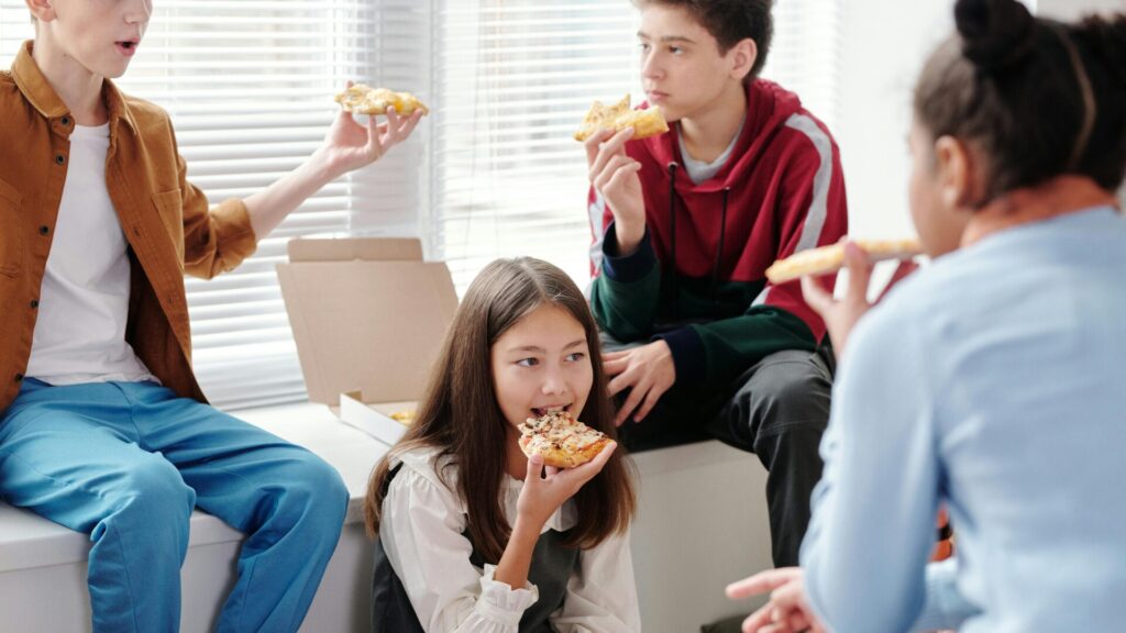 students eating lunch out during a Cambridge summer school