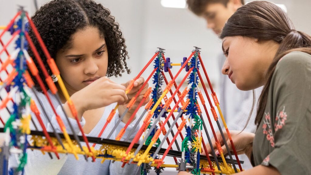 Engineering students working hard on a model to get into the University of Melbourne